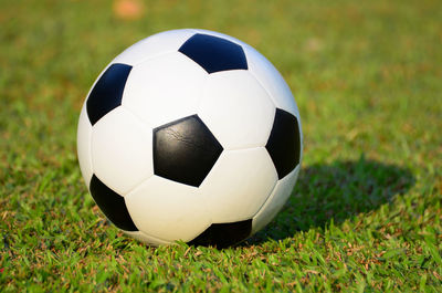 Close-up of soccer ball on field