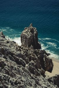 High angle view of rock formation in sea