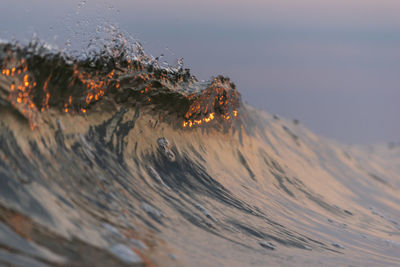 Scenic view of snowcapped mountains against sky during sunset