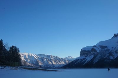 Scenic view of mountains against clear blue sky