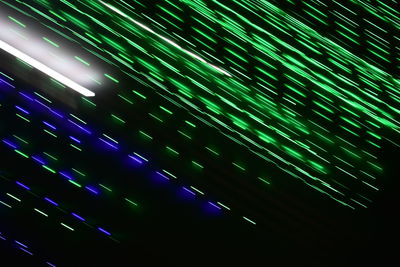 Low angle view of illuminated sky at night