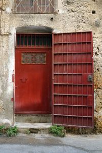 Red door on brick wall