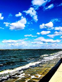 Scenic view of sea against blue sky