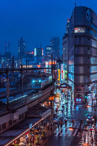 High angle view of city street and buildings at night