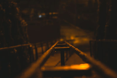 High angle view of illuminated footbridge at night