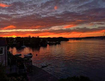 Scenic view of lake against orange sky