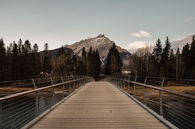 Footbridge against sky