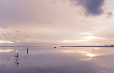 Scenic view of sea against sky at sunset