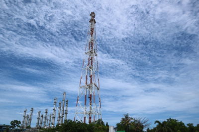 Low angle view of communications tower against sky