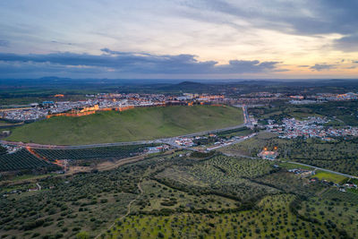 Elvas cityscape drone aerial panoramic view with beautiful green landscape of alentejo, in portugal