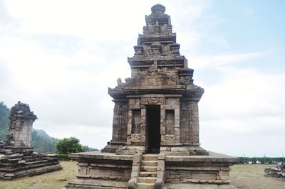 View of temple against cloudy sky