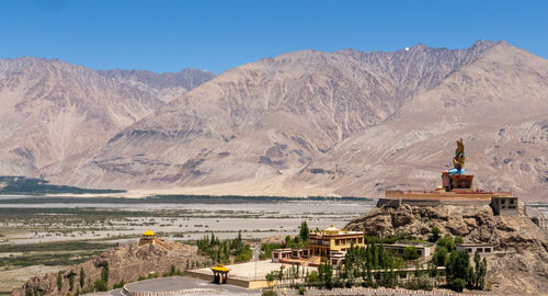 View of a building with mountain range in background