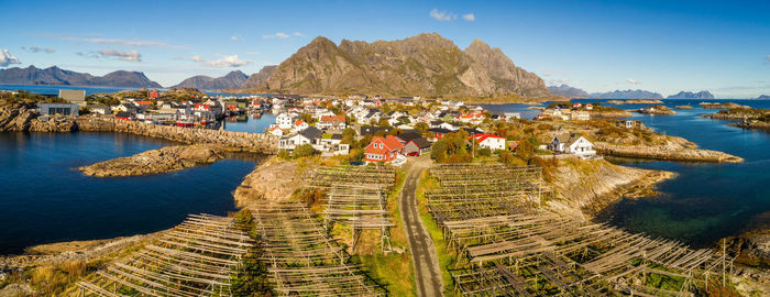 High angle view of townscape by sea against sky