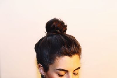 Close-up of woman holding white background