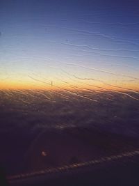 Scenic view of landscape against sky at sunset