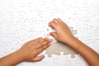 Close-up of human hand against white background