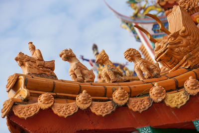 Low angle view of statue against sky