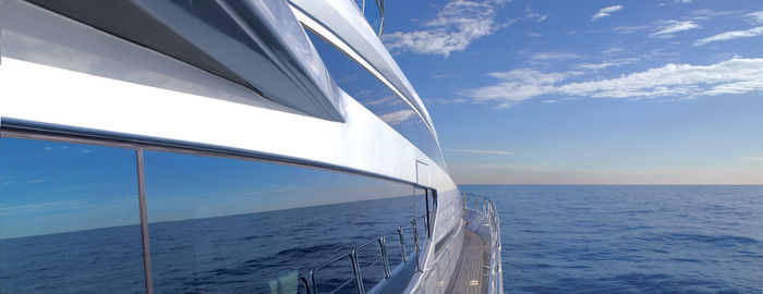 Sailboat sailing in sea against sky