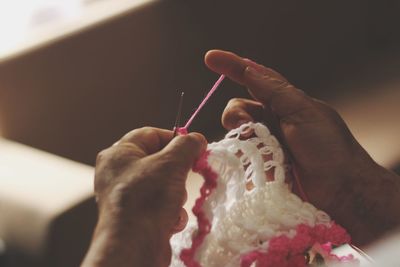 Close-up of woman knitting wool