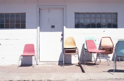 Empty chairs and tables in building