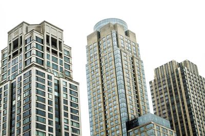 Low angle view of skyscrapers against clear sky