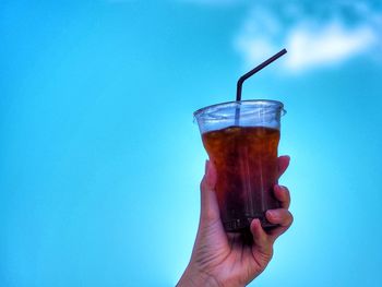 Close-up of hand holding drink