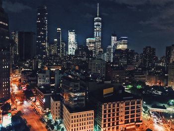 Aerial view of city lit up at night