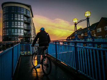 People in city at sunset