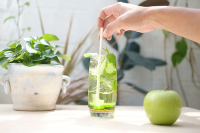 Close-up of hand holding drink