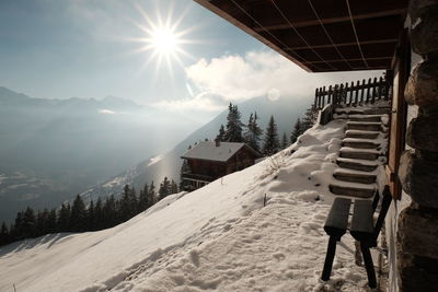 Scenic view of snow covered mountains against sky