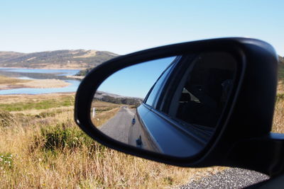 Cropped image of car on road