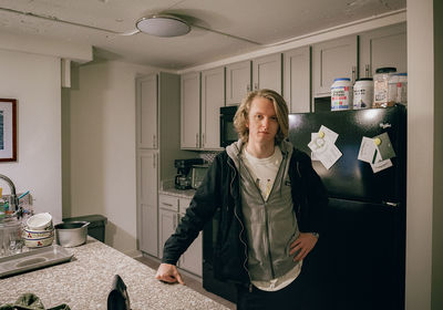 Portrait of woman standing at home