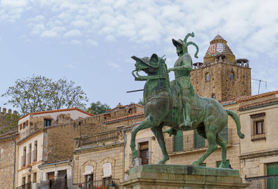 Low angle view of statue against sky