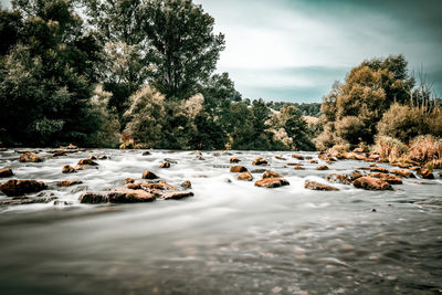 Scenic view of river against sky