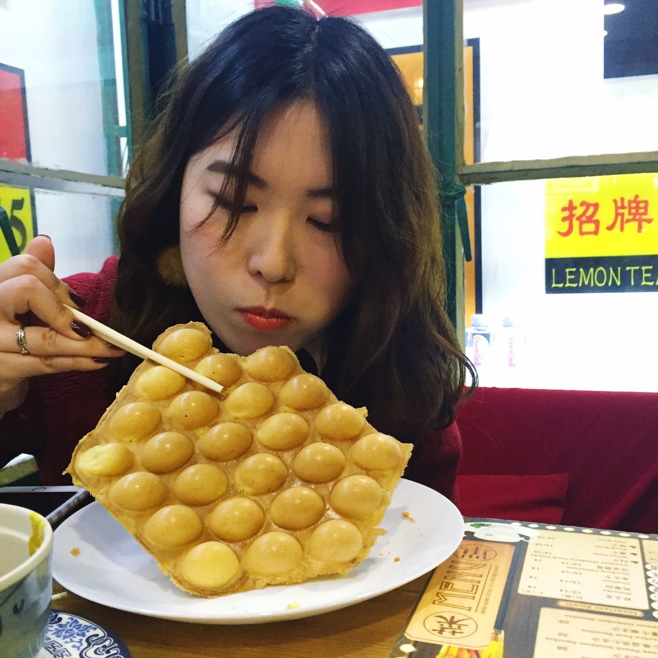 one person, food, food and drink, real people, sweet food, unhealthy eating, young women, indoors, young adult, ready-to-eat, close-up, only women, one young woman only, freshness, ice cream parlor, day, people, adult