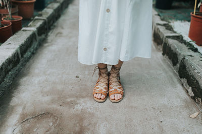 Low section of woman standing on floor