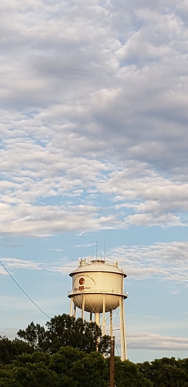 LOW ANGLE VIEW OF WATER TOWER AGAINST SKY SEEN FROM BUILDING