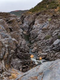 Rock formations on land against sky