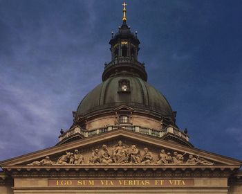 Low angle view of building against cloudy sky