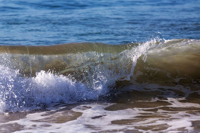 Sea waves splashing on shore