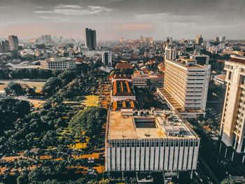 High angle view of city buildings against sky