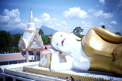 Panoramic shot of statues on building against sky