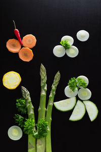 High angle view of fruits against black background
