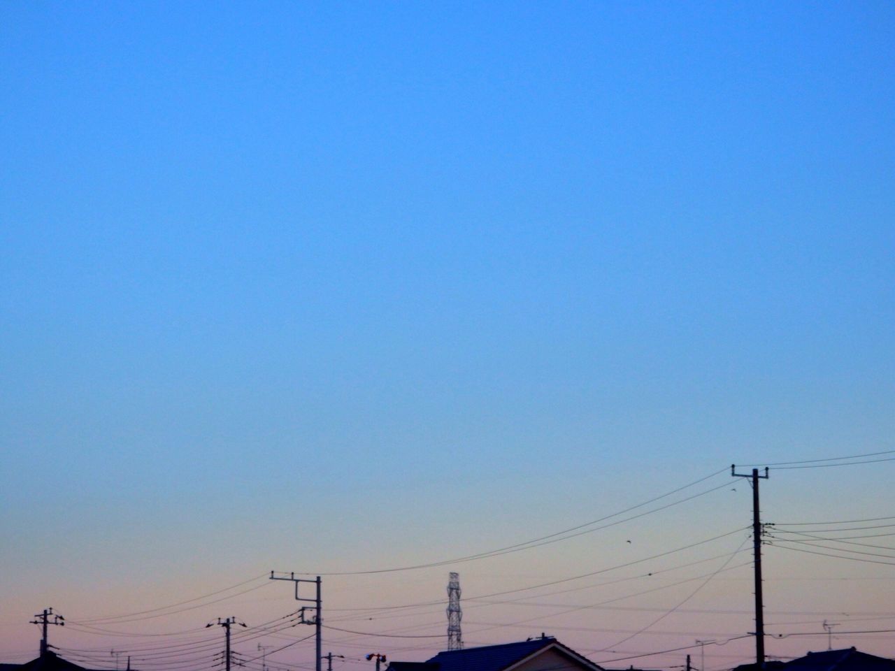 clear sky, copy space, power line, blue, low angle view, connection, electricity pylon, electricity, power supply, cable, technology, power cable, silhouette, fuel and power generation, sunset, outdoors, high section, no people, built structure, nature