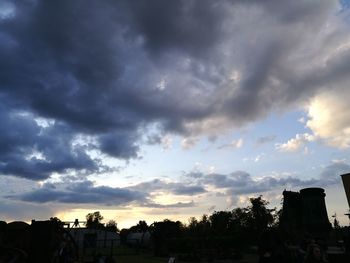 Low angle view of storm clouds over city