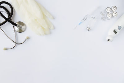 High angle view of objects on white table