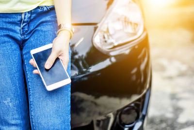 Close-up of young woman using mobile phone