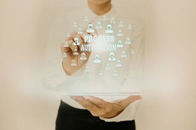 Digital composite image of woman holding smart phone