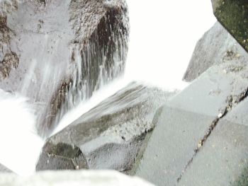 Close-up of waterfall against sky