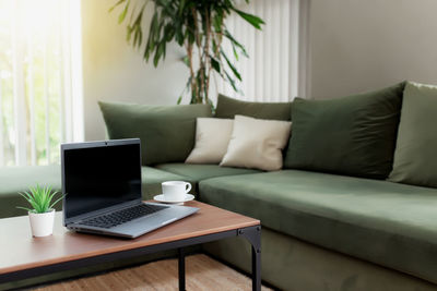 Table and chairs on sofa at home